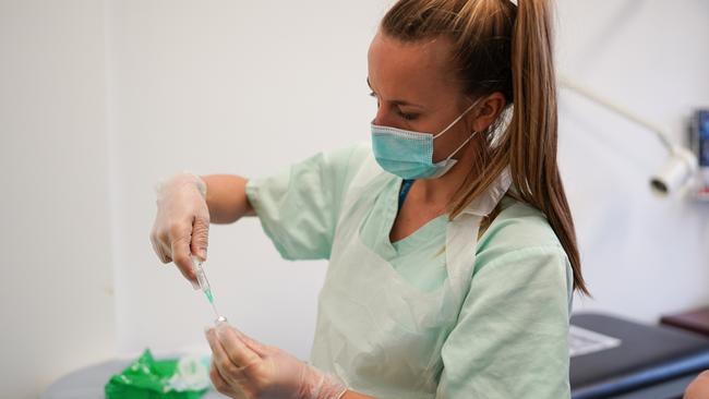 Nikki Brown, a primary care practitioner prepares a Pfizer BioNTech COVID-19 vaccine. Picture: Ian Forsyth/Getty