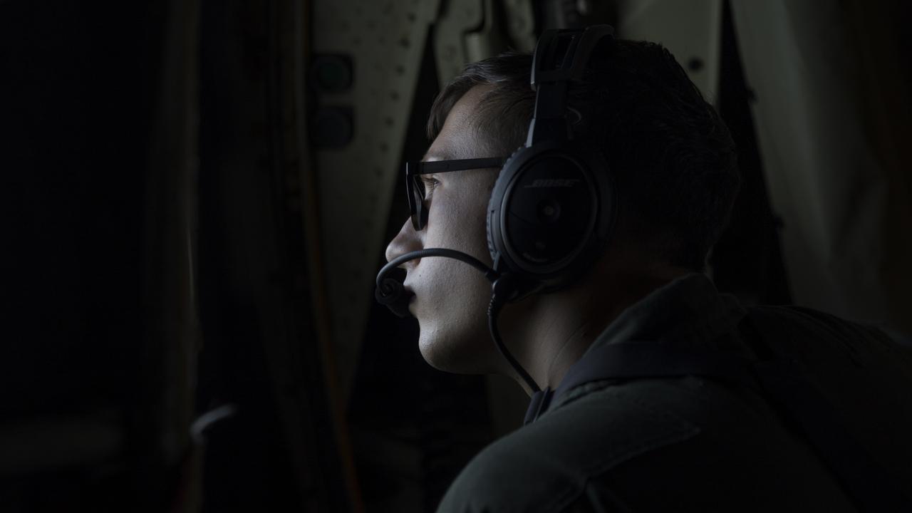 U.S. Marine Corps Lance Cpl. Benjamin Reinhardt, a loadmaster with Marine Aerial Refueler Transport Squadron (VMGR) 152, observes a refueling operations in flight during aerial refueling in support of Exercise Talisman Sabre 21, Australia, July 13, 2021. TS21, the ninth iteration and conducted since 2005, occurs biennially across Northern Australia. Australian, US and other multinational partner forces use Talisman Sabre to enhance interoperability by training in complex, multi-domain operations scenarios that address the full range of Indo-Pacific security concerts. (U.S. Marine Corps photo by Cpl. Bryant Rodriguez)