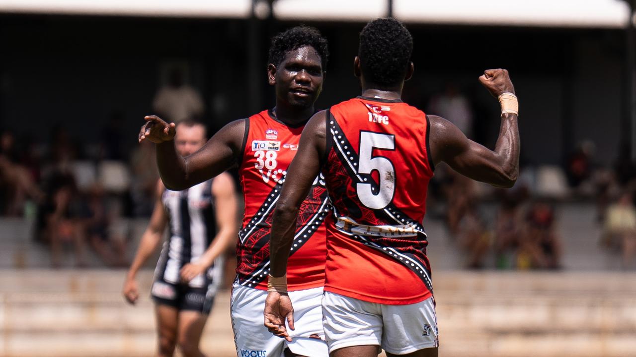 William Munkara and Kim Kantilla celebrate a goal for the Tiwi Bombers in the 2024-25 NTFL season. Picture: Jack Riddiford / AFLNT Media