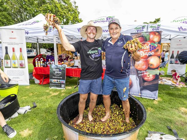 President Russell Wantling and Ambassador David McMahon promoting the Stanthorpe Apple &amp; Grape Harvest Festival at Jan Power's Farmers Market, New Farm, Saturday, January 20, 2024 – Picture: Richard Walker