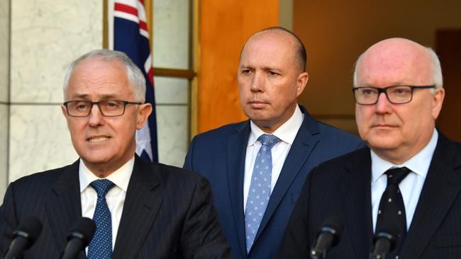 Shake up: Prime Minister Malcolm Turnbull, Minister for Immigration Peter Dutton and Attorney-General George Brandis.