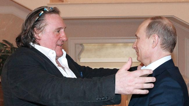 French actor Gerard Depardieu greets Russian President Vladimir Putin during a visit in 2013.