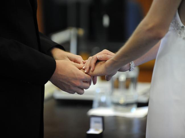 WEDDING DAY: Cameron and Andrea Von Doom at the Bundaberg Courthouse.Photo: Mike Knott / NewsMail