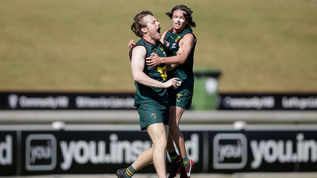 SPRINGFIELD, AUSTRALIA – OCTOBER 13: Hayden Britten and Joel Corbett celebrate the goal that gave Tasmania the premiership winning lead. (Photo by Russell Freeman/AFL Photos via Getty Images)