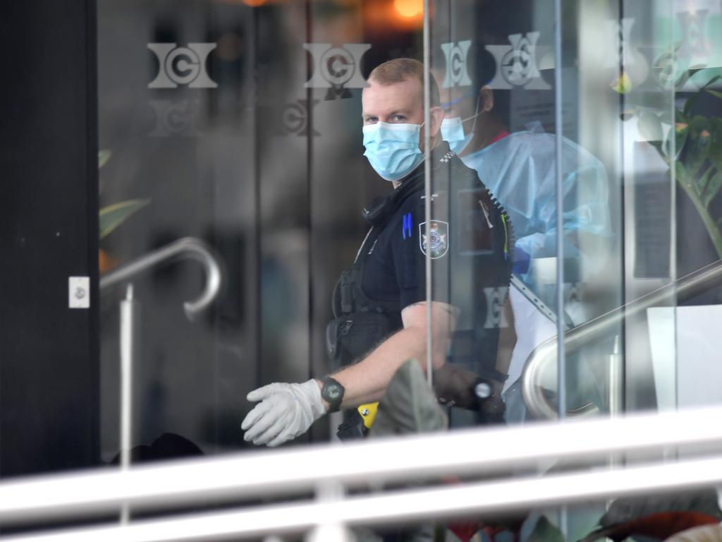 Police keep guard at the Hotel Grand Chancellor where a cleaner tested positive to coronavirus. Picture: John Gass/NCA NewsWire