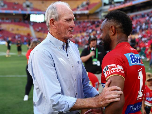 BRISBANE, AUSTRALIA - MARCH 05: Dolphins coach Wayne Bennett with players after the round one NRL match between the Dolphins and Sydney Roosters at Suncorp Stadium on March 05, 2023 in Brisbane, Australia. (Photo by Chris Hyde/Getty Images)