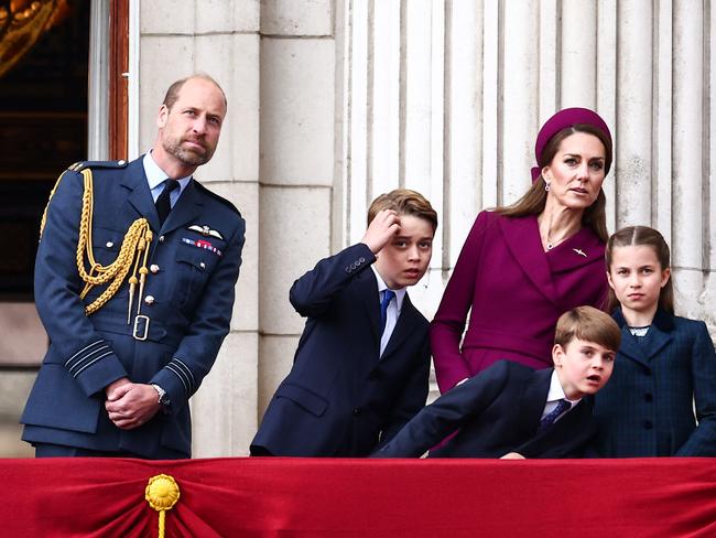TOPSHOT - (From L to R) Britain's Prince William, Prince of Wales, Britain's Prince George of Wales, Britain's Prince Louis of Wales, Britain's Catherine, Princess of Wales and Britain's Princess Charlotte of Wales watch the flypast from Buckingham Palace balcony after attending the armed forces procession on May 5, 2025 to celebrate the 80th anniversary of VE Day also known as Victory in Europe Day, marking the end of the Second World War in Europe. (Photo by HENRY NICHOLLS / AFP)
