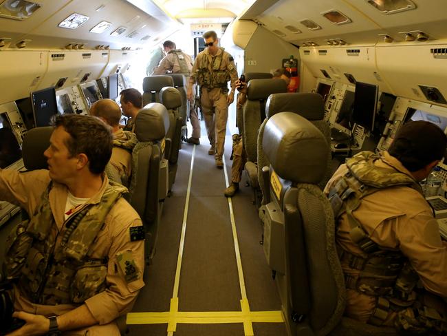 All abord ... aircrew on a Royal Australian Air Force E-7A Wedgetail aircraft prepare for a mission in the Middle East. Picture: Supplied