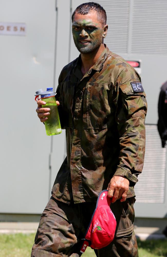 Karmichael Hunt wears army fatigues and sports camo make-up.