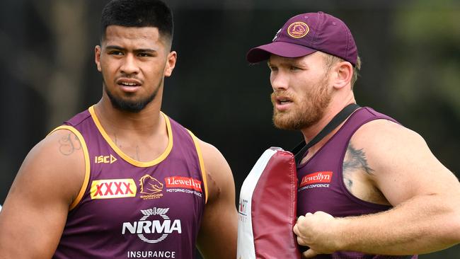 Payne Haas (left) and Matt Lodge (right) are seen during Brisbane Broncos training at Clive Berghofer Field in Brisbane, Wednesday, April 10, 2019. The Broncos are playing the West Tigers in their round 5 NRL clash in Brisbane on Thursday night. (AAP Image/Darren England) NO ARCHIVING