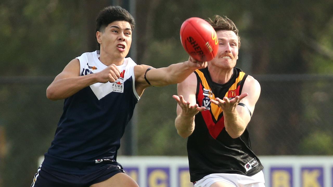 Ballarat: Melton South’s Paul Curtis spoils Alex Porter of Bacchus Marsh. Picture: Hamish Blair