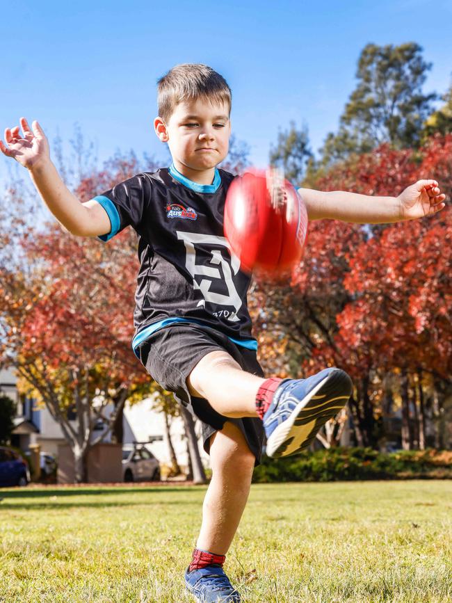 Hugo’s favourite part of footy is kicking the ball. Picture: Russell Millard Photography