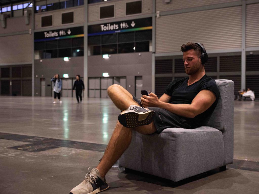 Evacuees photographed inside of the exhibition hall where they are staying. Picture: Flavio Brancaleone