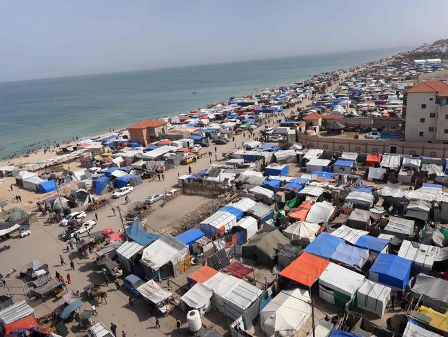 Tents housing internally displaced Palestinians crowd the beach and the Mediterranean shoreline in Deir el-Balah in the central Gaza Strip. Picture: AFP