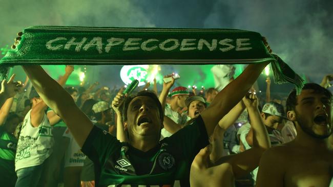 Brazil's Chapecoense football club fans participate in a tribute to the players killed in a plane crash. Picture: Nelson Almeida.