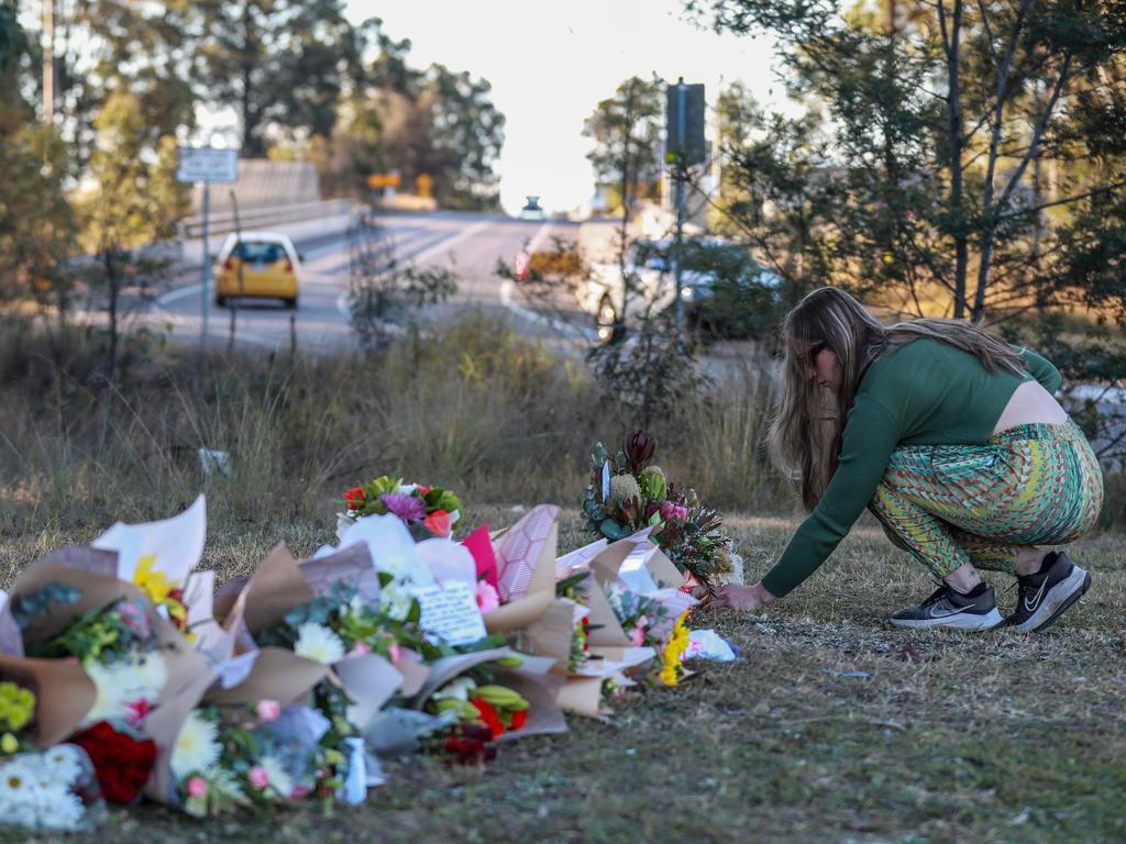 Floral tributes have been left near the site of the bus crash. Picture: Roni Bintang/Getty Images.