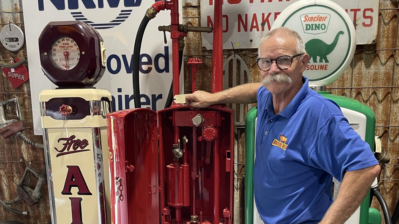 Mike Munday with a 1916 petrol bowser make in Milwaukee, USA by Milwaukee Tank Works and distributed in Melbourne.