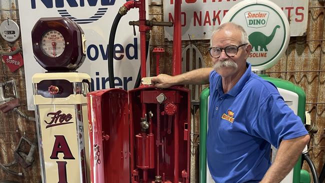 Mike Munday with a 1916 petrol bowser make in Milwaukee, USA by Milwaukee Tank Works and distributed in Melbourne.