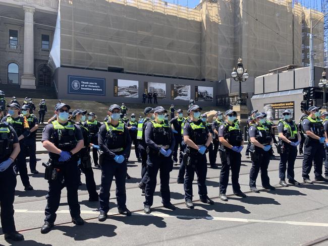 Police stand guard at an anti-lockdown protest in Melbourne on November 3. Picture: Brianna Travers