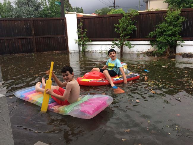 Reader Menchi Schneier sent in this photo of his sons, Eli, 11, and Dovi, 12, floating in the front yard of their Caulfield home.