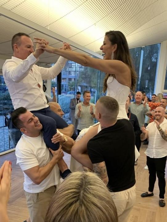 Dustin Martin holds Vicky Sim on his shoulder at her wedding to Michael Hargraves. Picture: Instagram