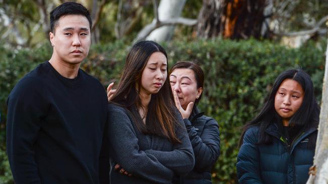 The girlfriend of Thumith Chandrasena at the scene of the fatal accident which claimed his life and that of his friend, Zarif Rahman. Picture: Brenton Edwards