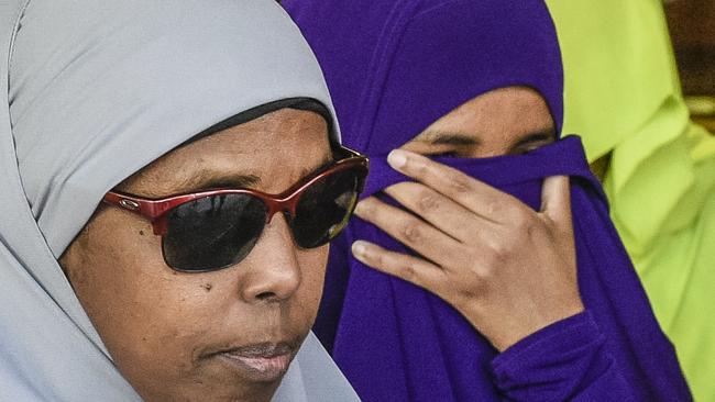 Zainab Abdirahman Khalif, right, leaves court following her acquittal. Picture: AAP/Roy Vandervegt.