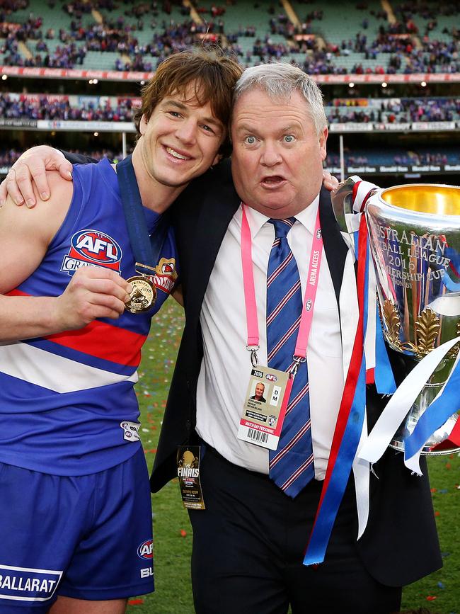 Picken with Bulldogs president Peter Gordon and the 2016 premiership cup. Picture: Mark Stewart