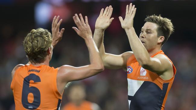 Toby Greene celebrates a goal with Lachie Whitfield. Picture: AAP Image/Craig Golding.