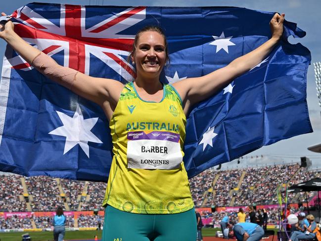 Australia's Kelsey-Lee Barber celebrates winning and taking the gold medal in the women's javelin throw final athletics event at the Alexander Stadium, in Birmingham on day ten of the Commonwealth Games in Birmingham, central England, on August 7, 2022. (Photo by Glyn KIRK / AFP)