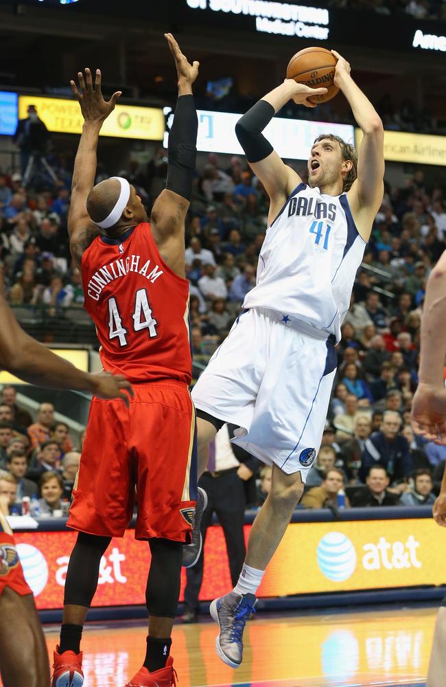 Dirk Nowitzki #41 of the Dallas Mavericks takes a shot against Dante Cunningham #44 of the New Orleans Pelicans.