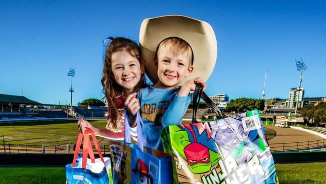 Tina and Tony White with their kids Lincoln, 4 and Felicity, 8 with showbags ahead of the Ekka. Picture: Nigel Hallett