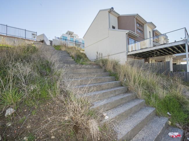 Stairs in empty blocks on Duranta Dr have become a battleground for residents. Picture: Rob Leeson.