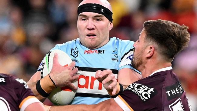 BRISBANE, AUSTRALIA - JUNE 08: Tom Hazelton of the Sharks takes on the defence during the round 14 NRL match between Brisbane Broncos and Cronulla Sharks at Suncorp Stadium, on June 08, 2024, in Brisbane, Australia. (Photo by Bradley Kanaris/Getty Images)