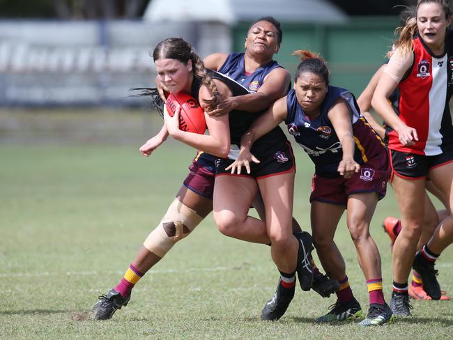 Saints' Grace Perry is tackled in the Cairns Women's match between the Cairns Saints and the Cairns City Lions, held at Griffiths Park, Manunda. Picture: Brendan Radke