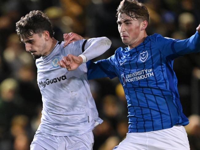 PORTSMOUTH, ENGLAND - JANUARY 28: Hayden Matthews of Portsmouth challenges Mihailo Ivanovic of Millwall during the Sky Bet Championship match between Portsmouth FC and Millwall FC at Fratton Park on January 28, 2025 in Portsmouth, England. (Photo by Mike Hewitt/Getty Images)