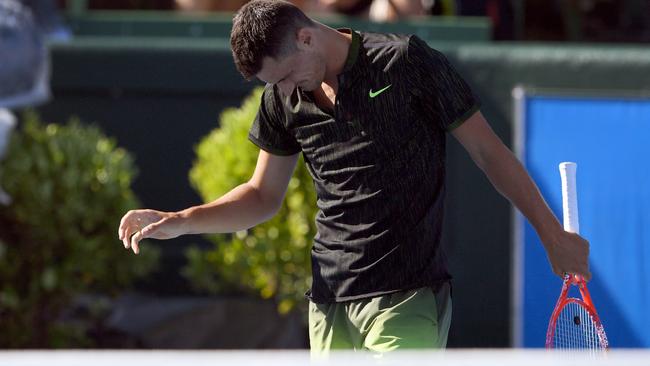 Bernard Tomic reacts after losing a point to Yoshihito Nishioka.