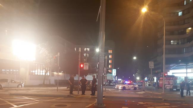 Police blocking a street in Surfers Paradise this evening.