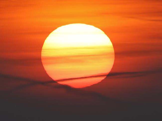 The sun sets over the apartment buildings in the town of Dzerzhinsk, 32 km (20 miles) west of the Belarus capital, Minsk, Monday, Nov. 6, 2017. (AP Photo/Sergei Grits)