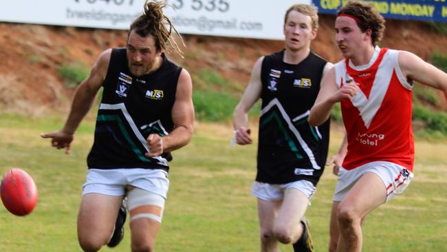 Omeo-Benambra's Travis Balmer hunts down the ball against Swan Reach. Picture: Rod Twining