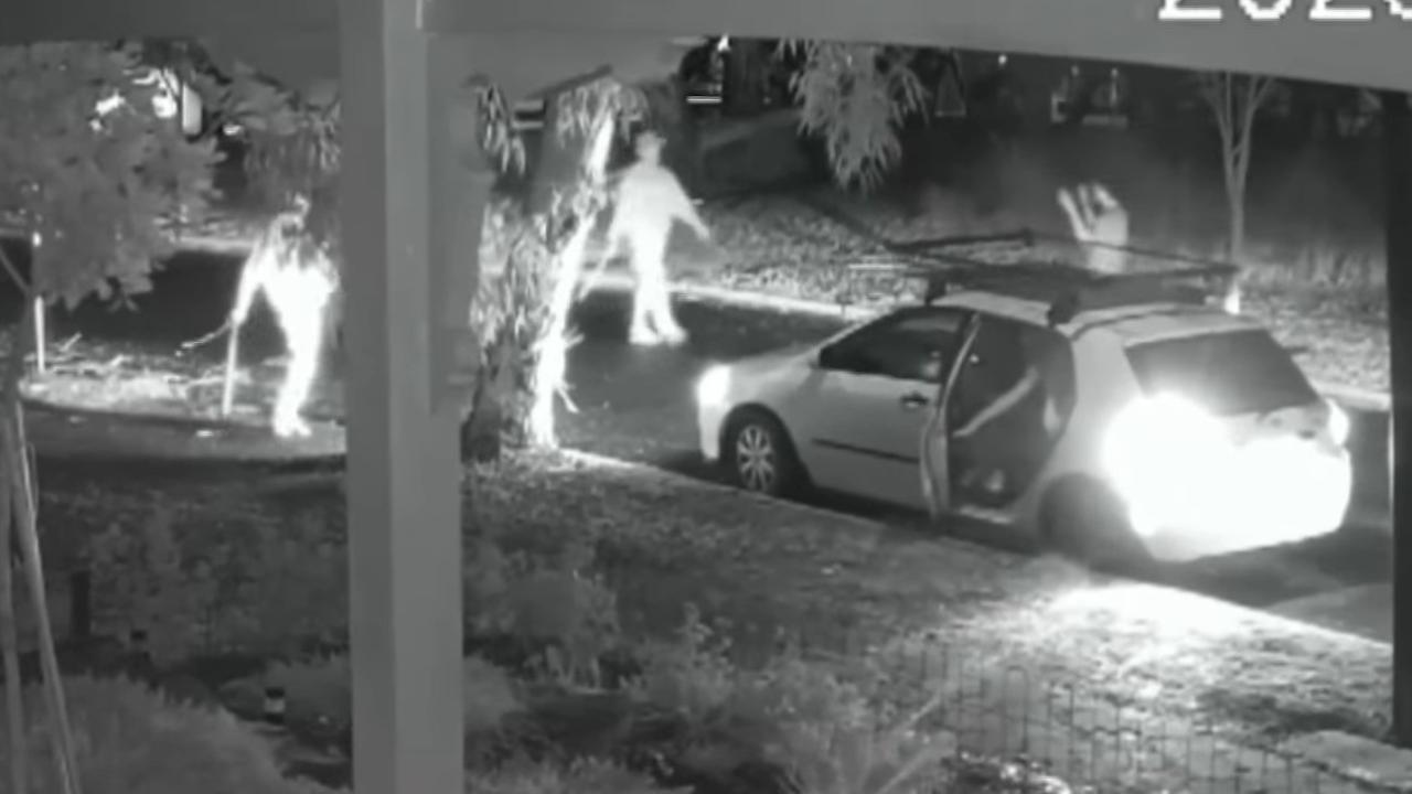 Two armed suspects approaching an unarmed male and a group of party-goers in a white Toyota Hatchback. Picture: Supplied
