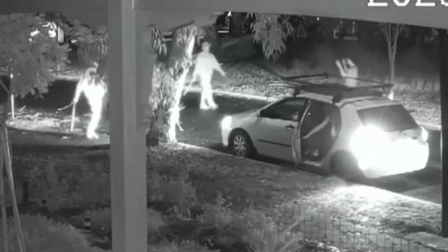 Two armed suspects approaching an unarmed male and a group of party-goers in a white Toyota Hatchback. Picture: Supplied