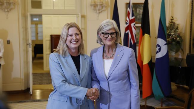 Minister for Agriculture, Fisheries and Forestry Julie Collins shakes hands with Governor-General Sam Mostyn during the swearing-in ceremony at Government House. Picture: Hilary Wardhaugh/Getty Images
