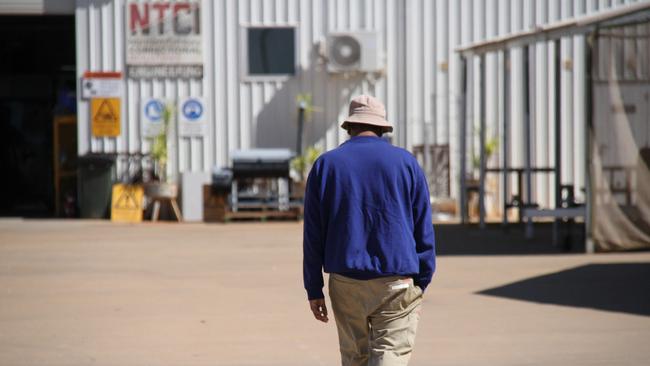 A prisoner walks through the prison industries facility in the Alice Springs Correctional Centre. Picture: Gera Kazakov