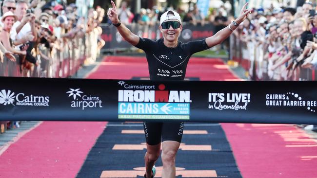 Kylie Simpson crosses the finish line to win the 2021 Ironman Cairns women's race. Picture: Brendan Radke