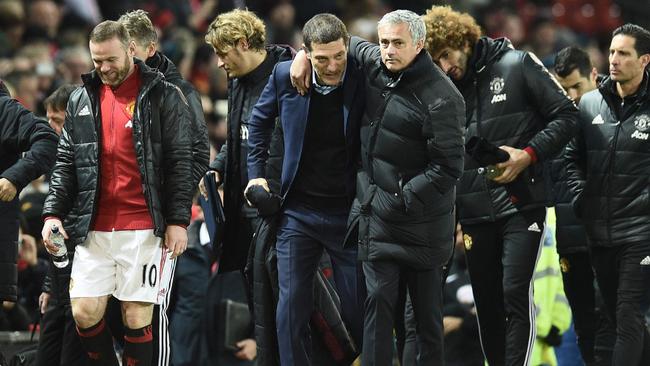 Jose Mourinho (CR) and West Ham United's Croatian manager Slaven Bilic (CL) .