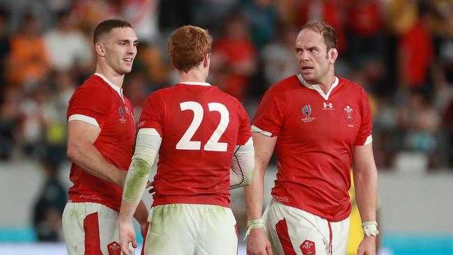 Rhys Patchell is congratulated by teammates Alun Wyn Jones (right) and George North (left) after Wales’ victory. (Photo by David Rogers/Getty Images)