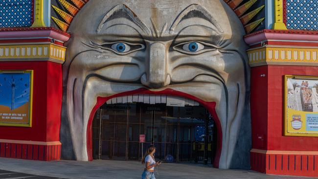 A lone person walks past the now-closed Luna Park yesterday. Picture: Asanka Ratnayake/Getty Images