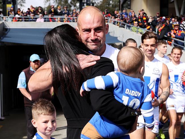 ADELAIDE, AUSTRALIA - AUGUST 13: Ben Cunnington of the Kangaroos walks out with his family during the 2022 AFL Round 22 match between the Adelaide Crows and the North Melbourne Kangaroos at Adelaide Oval on August 13, 2022 in Adelaide, Australia. (Photo by James Elsby/AFL Photos via Getty Images)