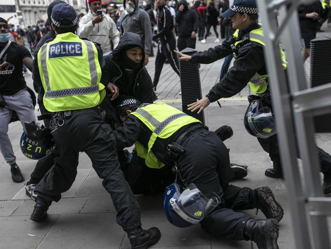 Demonstrators scuffle with members of the Tactical Support Group police officers during a Black Lives Matter protest in London. Picture: Getty Images